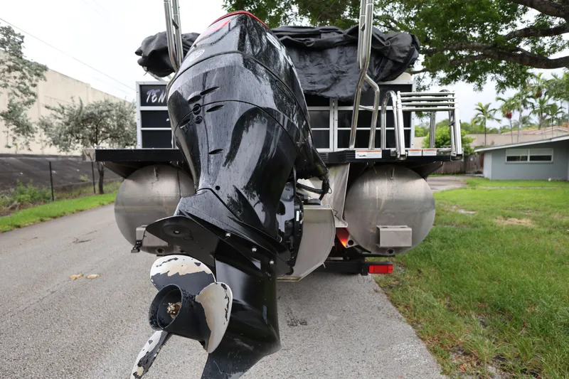 Slide: The Image of 2021 Lexington 525 cc boat with a powerful outboard motor on a residential street. - 4