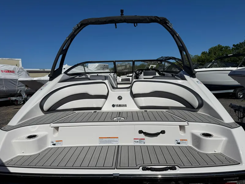 Slide: The Image of 2025 Yamaha Boats AR195, sleek design, spacious seating, modern features, ideal for water adventures. - 2
