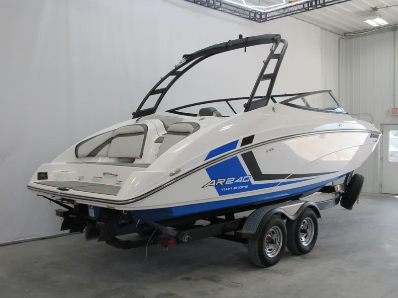 Slide: The Image of 2018 Yamaha AR240 boat on trailer in indoor showroom. - 2