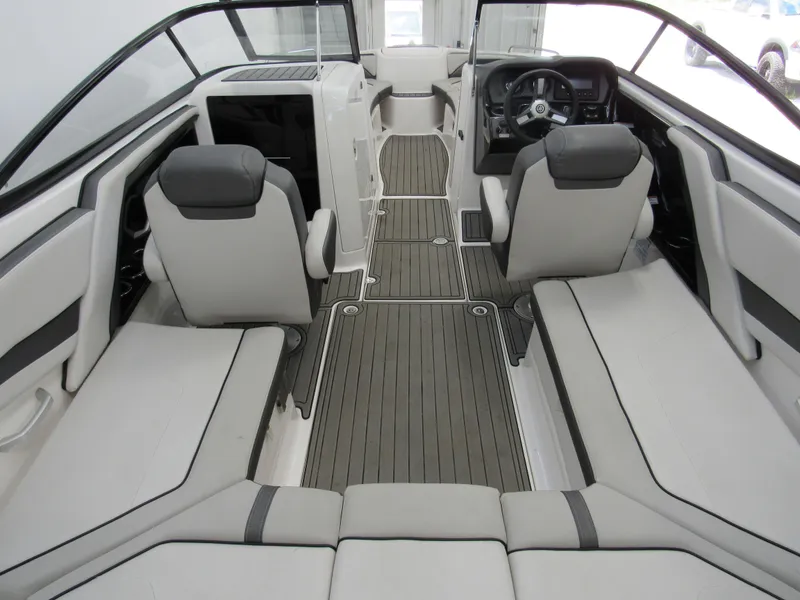 Slide: The Image of 2018 Yamaha Boats AR240 interior with sleek seating and modern dashboard design. - 4