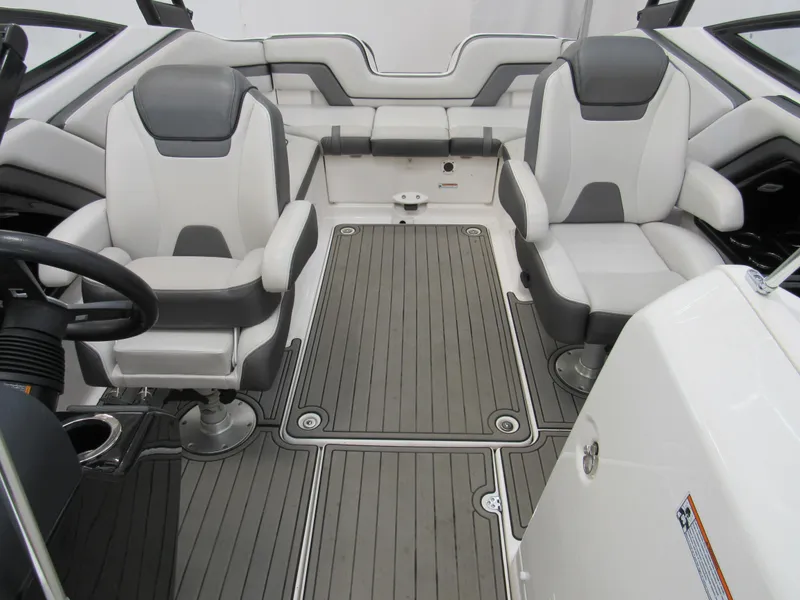 Slide: The Image of 2018 Yamaha AR240 boat interior with gray and white seating and flooring. - 8