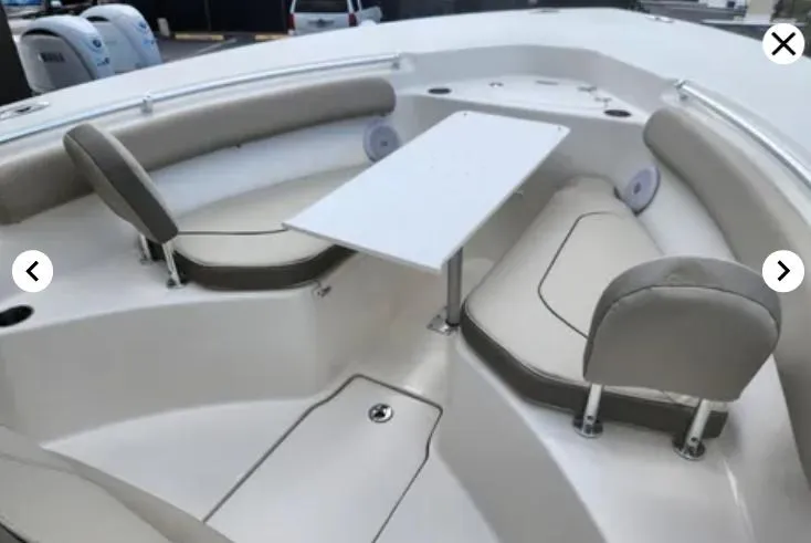 Slide: The Image of 2023 Key West 244 CC boat interior with seating and table, featuring modern design and comfort. - 11