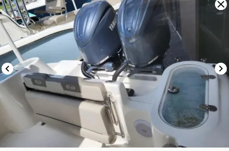 Slide: The Image of 2023 Key West 244 CC boat with dual Yamaha engines and livewell. - 3