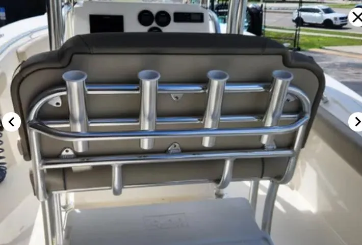 Slide: The Image of 2023 Key West 244 CC boat seat with rod holders and dashboard view. - 5