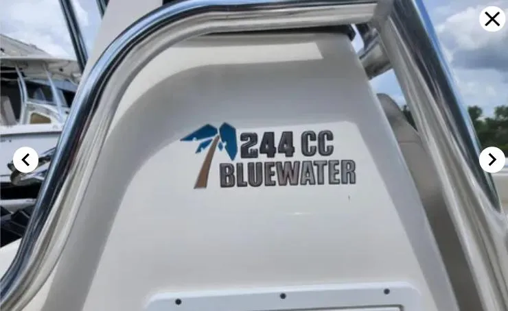 Slide: The Image of 2023 Key West 244 CC Bluewater boat logo with stainless steel railing. - 8