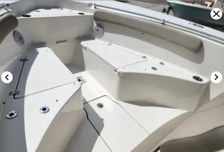 Slide: The Image of 2023 Key West 244 CC boat interior with seating and storage compartments. - 9