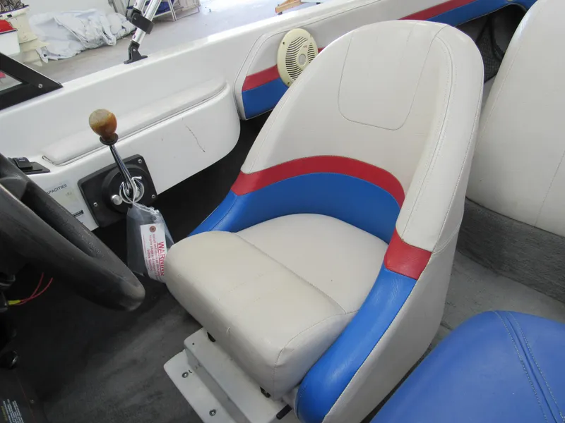 Slide: The Image of 1993 Hydrodyne Comp boat interior with white, blue, and red seating. - 11