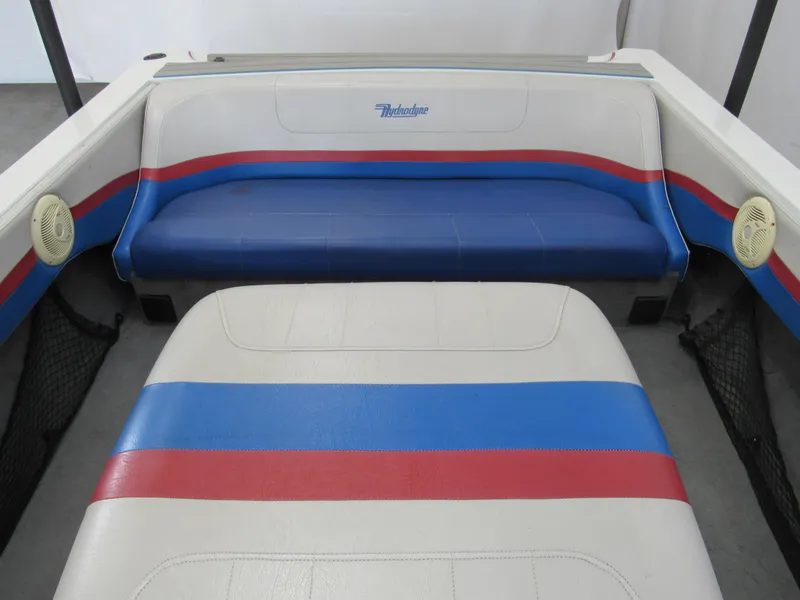 Slide: The Image of 1993 Hydrodyne Comp boat interior with blue, red, and white seating. - 5
