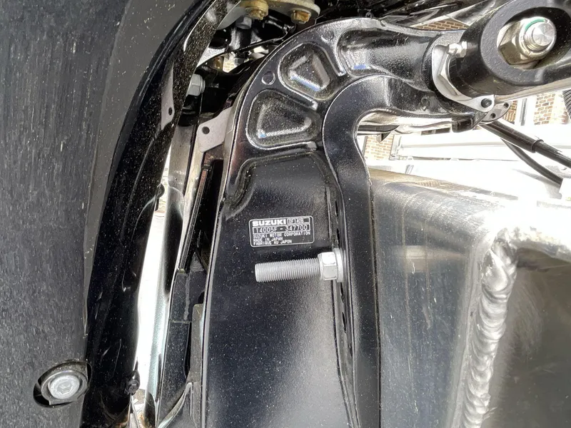 Slide: The Image of Close-up of 2025 South Bay 222RSLE boat engine mount with Suzuki label. - 10