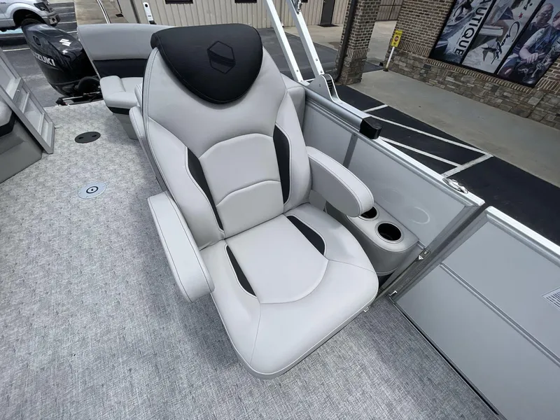 Slide: The Image of Luxurious seating on 2025 South Bay 222RSLE pontoon boat with cup holders and modern design. - 18