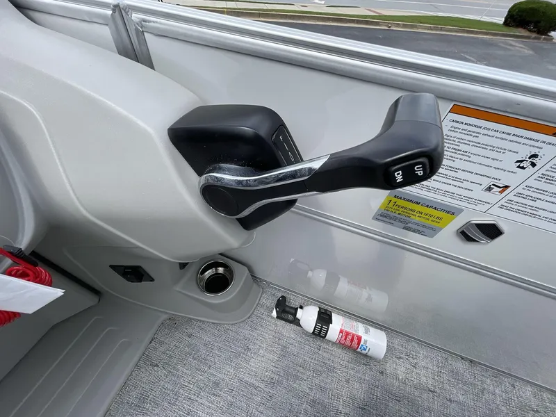 Slide: The Image of Control lever and safety instructions on 2025 South Bay 222RSLE boat. - 20