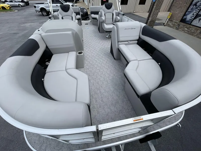 Slide: The Image of 2025 South Bay 222RSLE pontoon boat with spacious seating and modern design. - 24