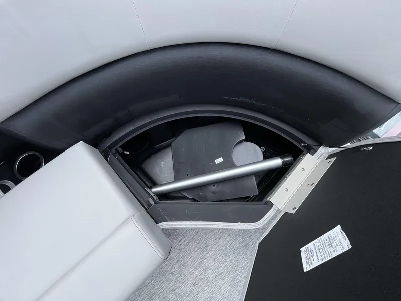 Slide: The Image of Open storage compartment in 2025 South Bay 222RSLE boat, showcasing interior details. - 25