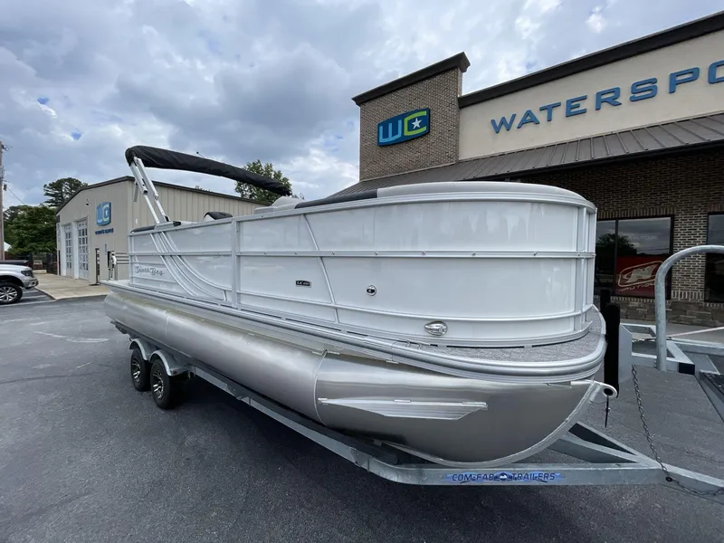 Slide: The Image of 2025 South Bay 222RSLE pontoon boat parked outside a watersports store. - 7