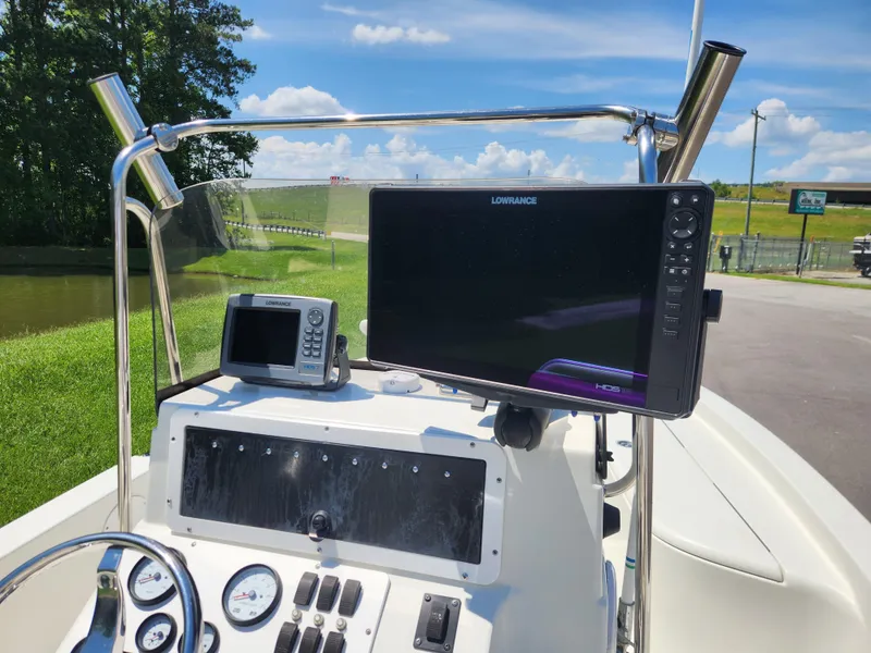 Slide: The Image of Control panel of a 2011 Ranger 220 Bahia boat with Lowrance electronics. - 12