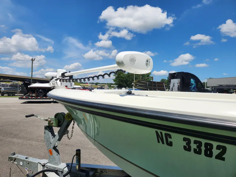 Slide: The Image of 2011 Ranger 220 Bahia boat on trailer under clear blue sky. - 7