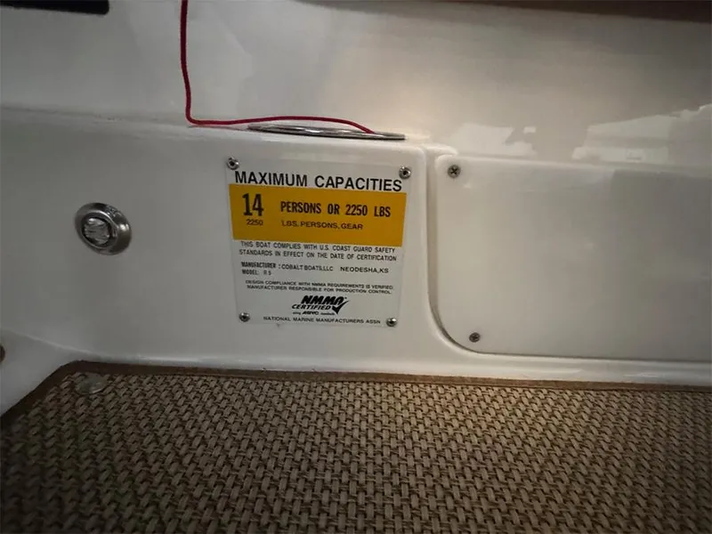 Slide: The Image of 2014 Cobalt R5 boat capacity label, maximum 14 persons or 2250 lbs. - 14