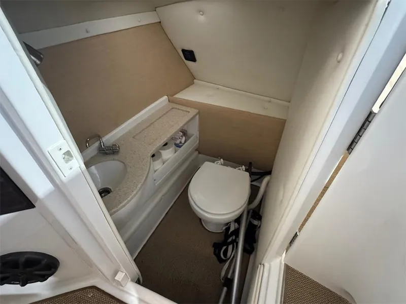 Slide: The Image of Compact bathroom in 2014 Cobalt R5 boat with sink and toilet. - 15