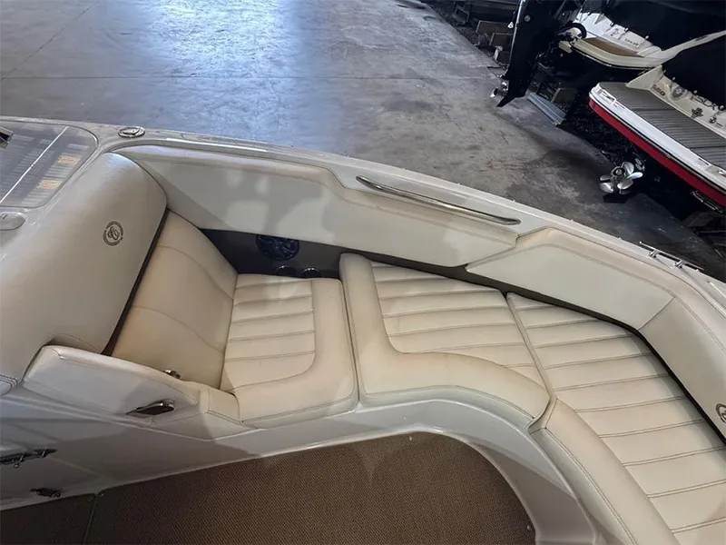 Slide: The Image of 2014 Cobalt R5 boat interior with beige leather seating in a showroom. - 18