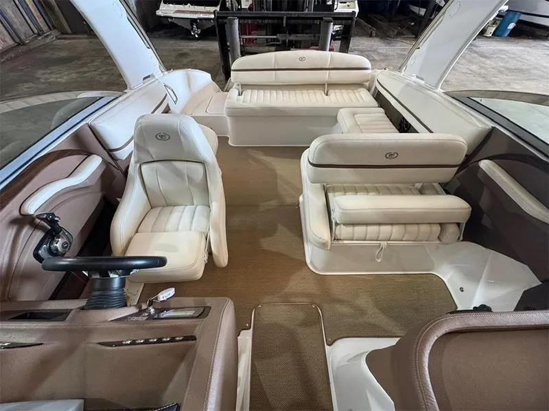 Slide: The Image of Interior of a 2014 Cobalt R5 boat with luxurious seating and steering wheel. - 20