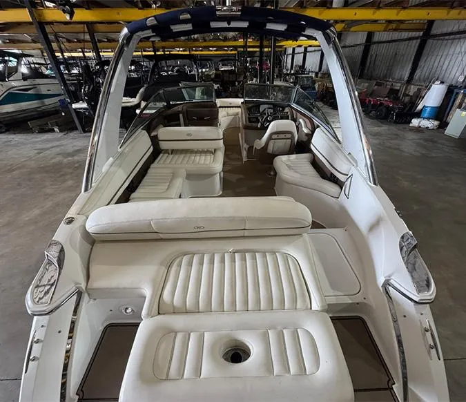 Slide: The Image of 2014 Cobalt R5 boat interior with white seating in a storage facility. - 6