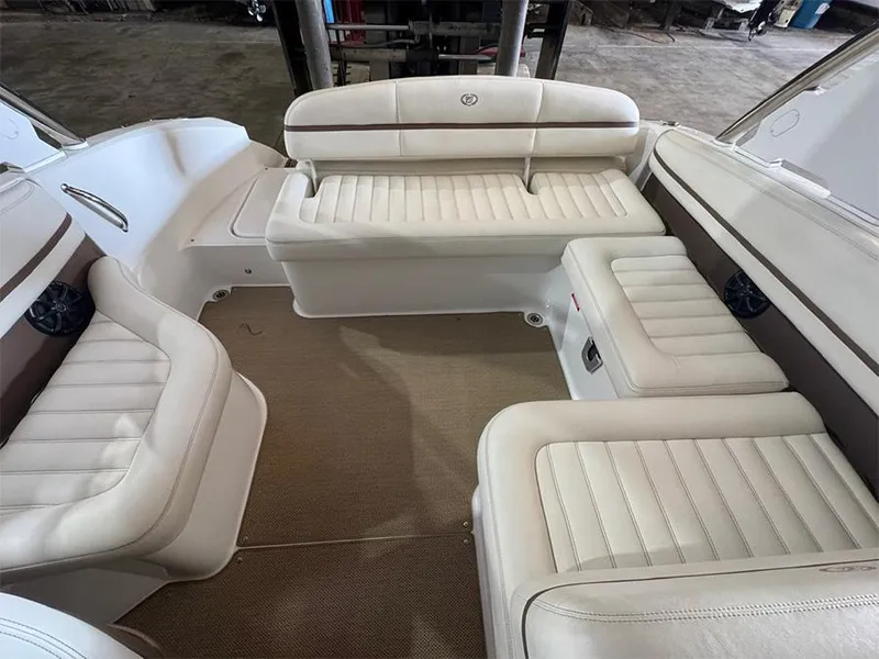 Slide: The Image of Luxurious seating area in a 2014 Cobalt R5 boat, featuring white leather upholstery. - 9
