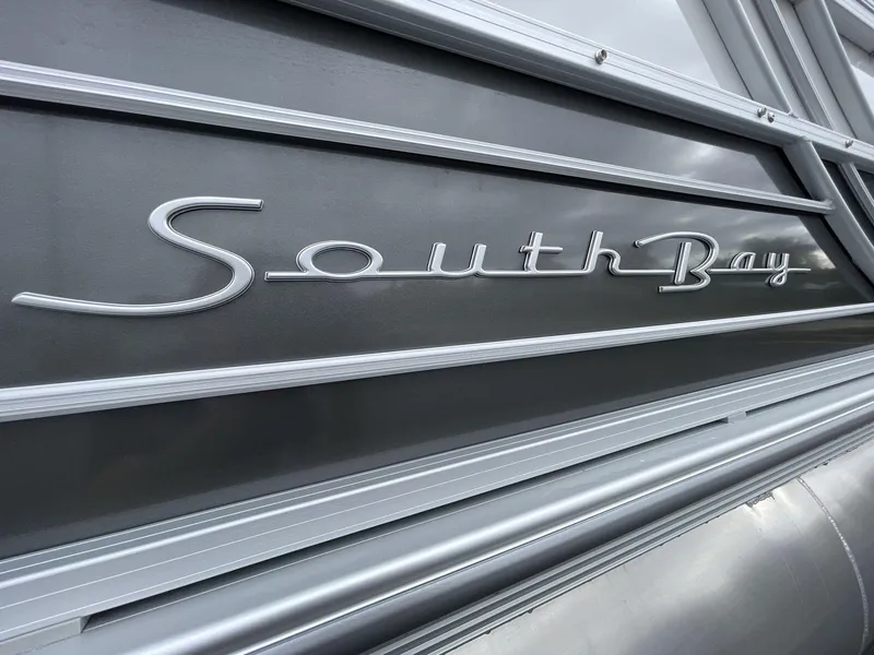 Slide: The Image of Close-up of 2025 South Bay 222 RSLE logo on sleek metallic surface. - 11