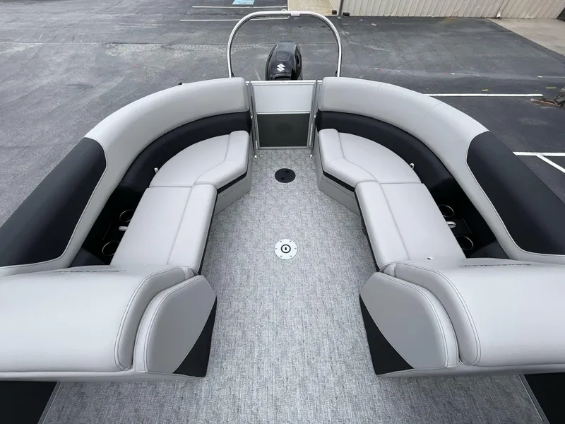 Slide: The Image of 2025 South Bay 222 RSLE pontoon boat with spacious seating and modern design. - 12