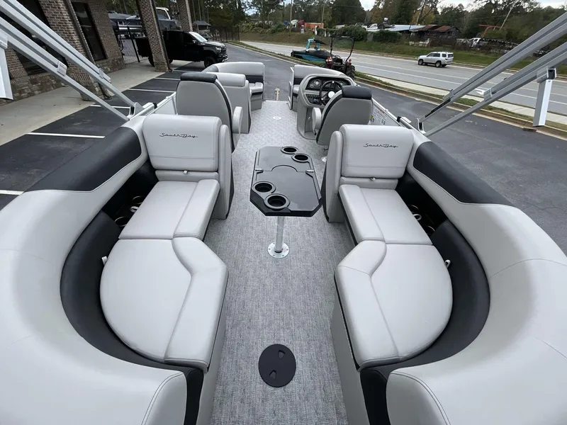 Slide: The Image of 2025 South Bay 222 RSLE pontoon boat interior with luxurious seating and modern design. - 20