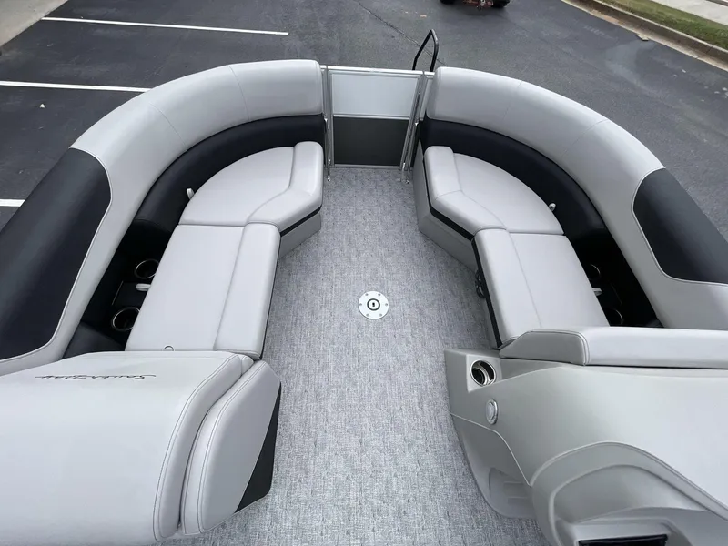 Slide: The Image of 2025 South Bay 222 RSLE pontoon boat interior with gray seating and carpeted floor. - 29
