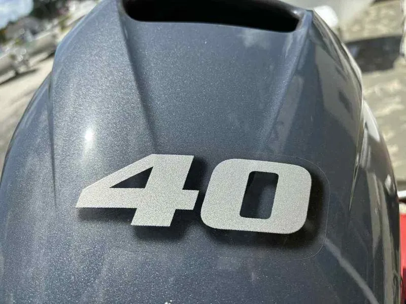 Slide: The Image of Close-up of 2023 Tracker Grizzly 1648 Jon boat engine with '40' marking. - 10