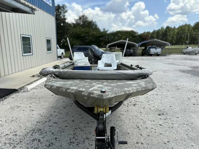 Slide: The Image of 2023 Tracker Grizzly 1648 Jon boat on trailer, parked outdoors. - 6