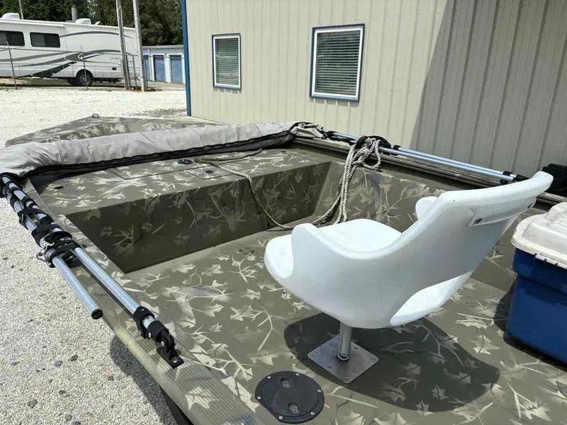 Slide: The Image of 2023 Tracker Grizzly 1648 Jon boat with camouflage design and swivel seat. - 7