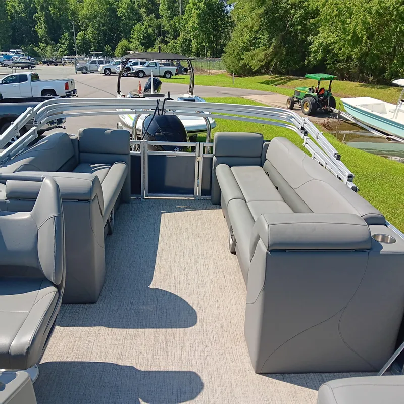 Slide: The Image of 2022 Avalon VLS Quad Lounge pontoon boat with spacious seating and modern design. - 12