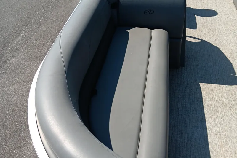 Slide: The Image of 2022 Avalon VLS Quad Lounge with sleek gray seating on a boat deck. - 6