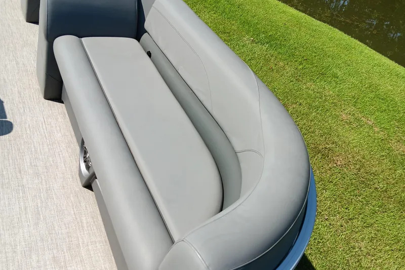 Slide: The Image of 2022 Avalon VLS Quad Lounge with sleek gray seating on a sunny day. - 7