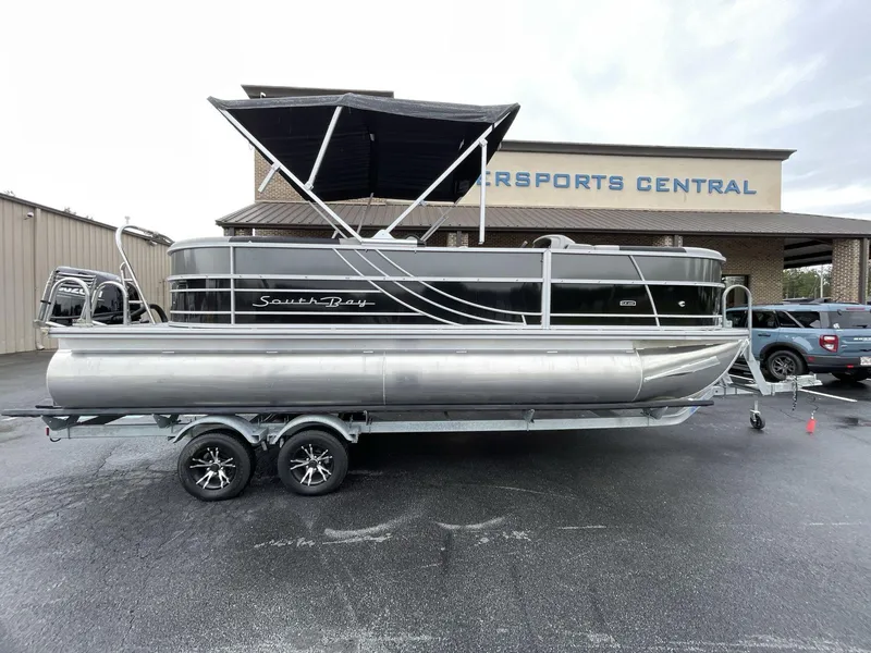 Slide: The Image of 2025 South Bay 222RSLE pontoon boat with canopy at dealership. - 14