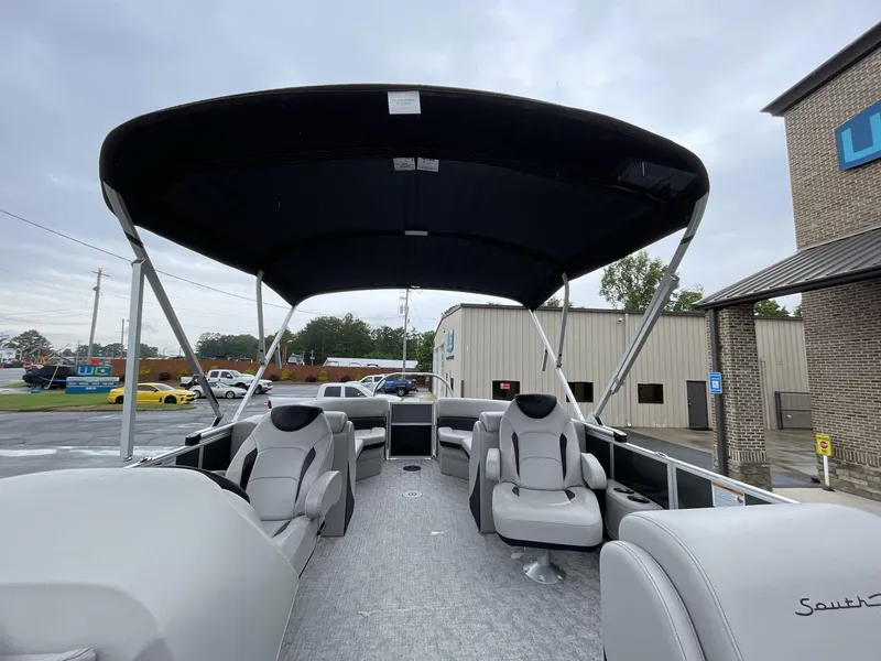 Slide: The Image of 2025 South Bay 222RSLE pontoon boat with canopy and luxurious seating. - 19