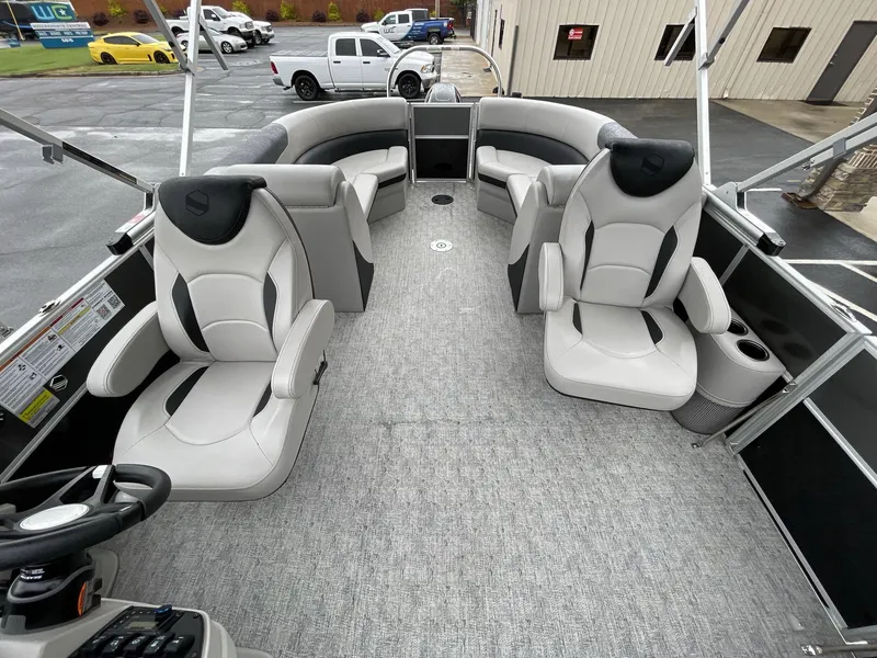 Slide: The Image of 2025 South Bay 222RSLE pontoon boat interior with plush seating and modern design. - 20