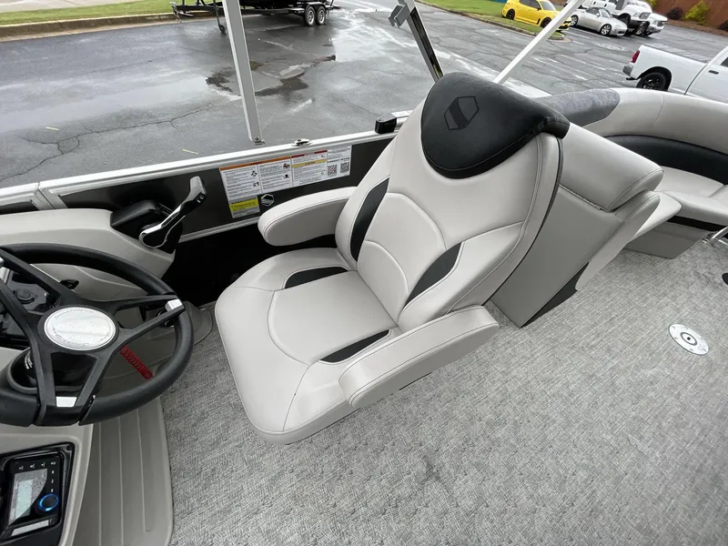 Slide: The Image of 2025 South Bay 222RSLE boat interior with modern steering and comfortable seating. - 26