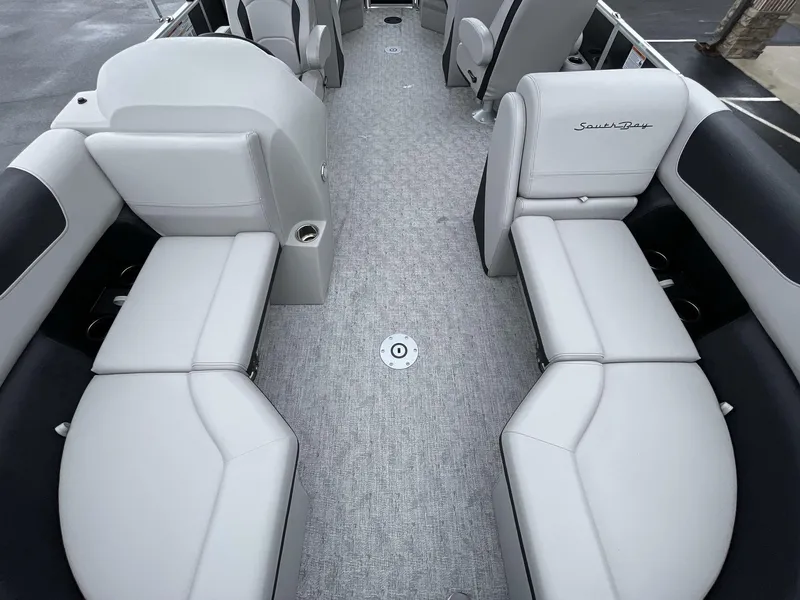 Slide: The Image of 2025 South Bay 222RSLE pontoon boat interior with gray seating and carpet flooring. - 31