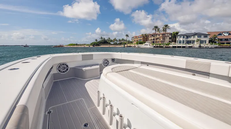 Slide: The Image of 2022 Freeman 43 boat deck with waterfront view and luxury homes. - 10