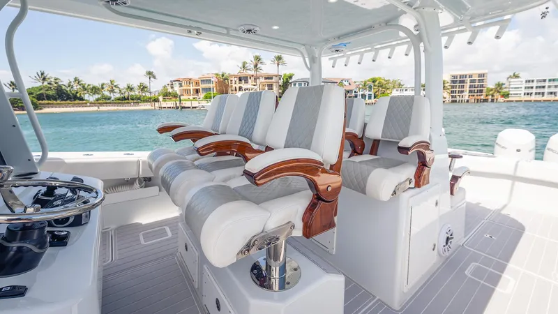 Slide: The Image of Luxurious seating on a 2022 Freeman 43 boat, with ocean view and modern design. - 14