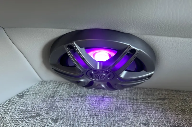 Slide: The Image of Illuminated speaker in 2025 South Bay 222RSLE boat interior, featuring purple LED lighting. - 3