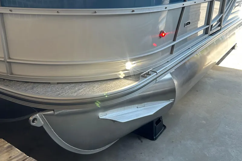 Slide: The Image of 2025 South Bay 222RSLE pontoon boat, close-up of aluminum hull and deck details. - 4