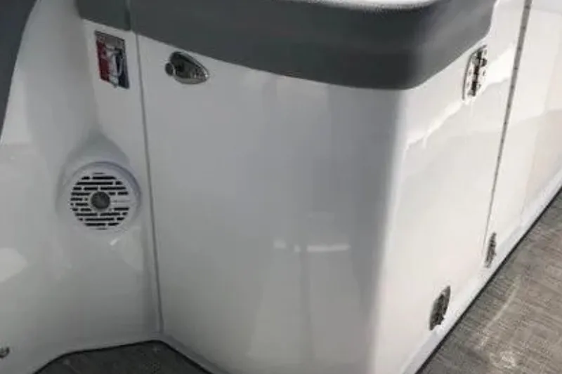 Slide: The Image of 2018 Cobalt R35 boat interior with speaker and storage compartments. - 13