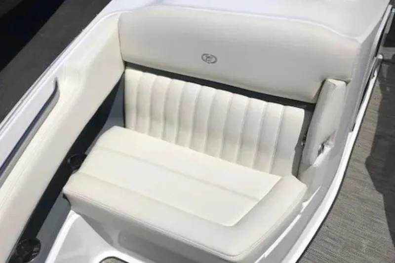 Slide: The Image of White leather seating in a 2018 Cobalt R35 boat interior. - 19