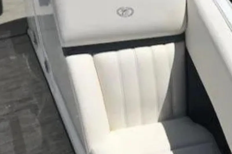 Slide: The Image of White leather seat in a 2018 Cobalt R35 boat, featuring elegant stitching. - 20