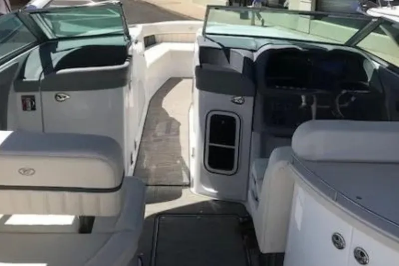 Slide: The Image of Interior view of a 2018 Cobalt R35 boat, featuring seating and dashboard. - 3