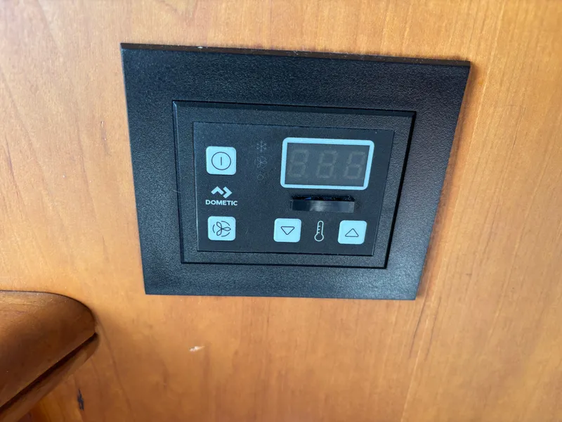 Slide: The Image of Interior of 2001 Silverton 410 Sport Bridge with wooden cabinetry and cozy seating area. - 12